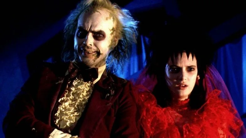 Here Yeh! Here Yeh! In Today’s Film News: Beetlejuice 2 Is Back On The Discussion Table With Brad Pitt Producing Plus OG Stars Michael Keaton & Winona Ryder Reprising Their Iconic Roles!