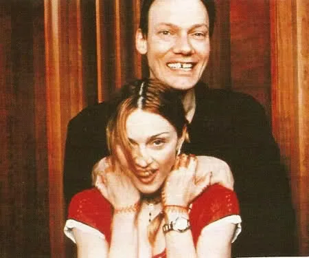 William Orbit standing behind Madonna with his hands on her shoulders