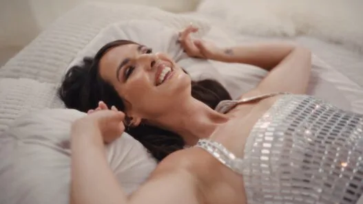 Lara McAllen of Angel City posing in the “Love Me Right 2025” music video.