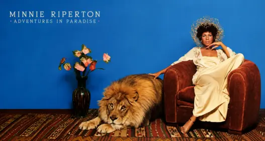 Minnie Riperton seated beside a lion in artwork inspired by her 1975 album Adventures in Paradise