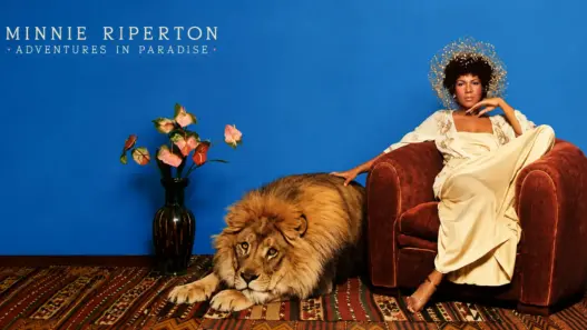 Minnie Riperton seated beside a lion in artwork inspired by her 1975 album Adventures in Paradise