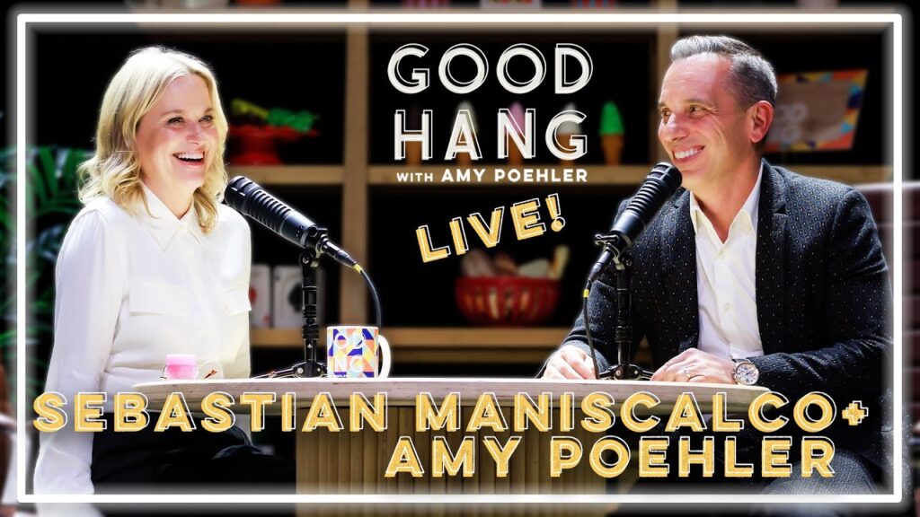 Sebastian Maniscalco and Amy Poehler laughing during live Good Hang taping
