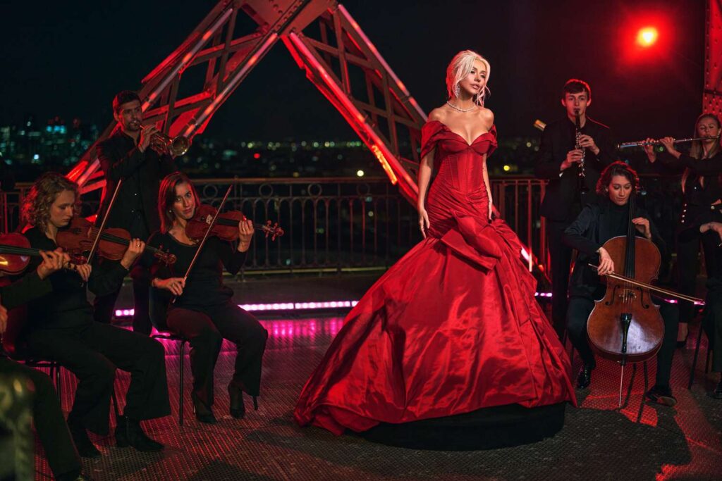 Christina Aguilera performing in front of Eiffel Tower for Christmas in Paris