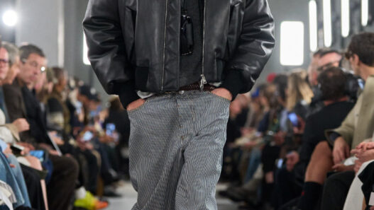 AMI FW26 runway inside an industrial Paris venue