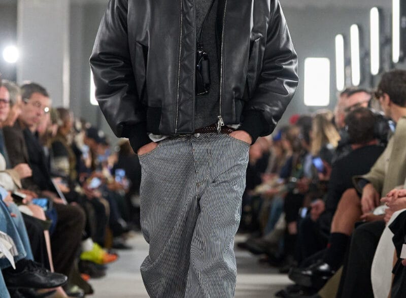 AMI FW26 runway inside an industrial Paris venue