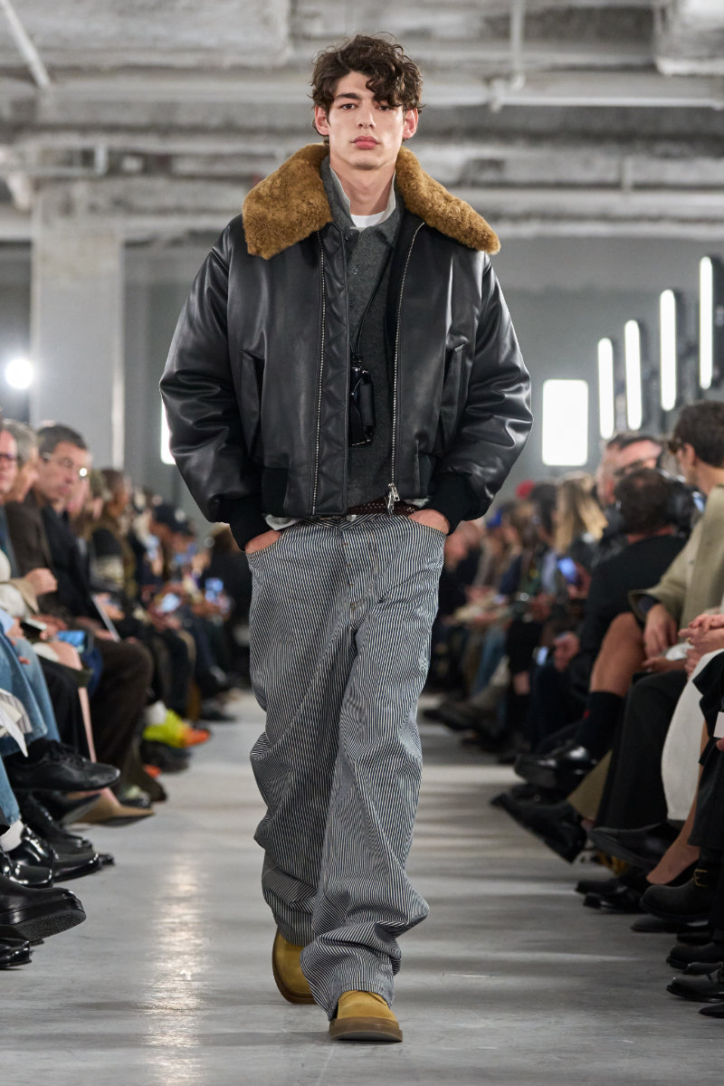 AMI FW26 runway inside an industrial Paris venue