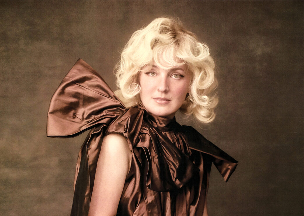 Cam performing or posing for the All Things Light era