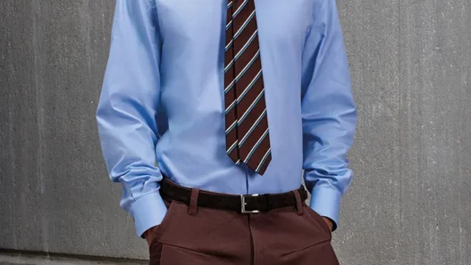 KNT Autumn Winter 2026/2027 menswear look featuring tailored outerwear and technical knitwear.