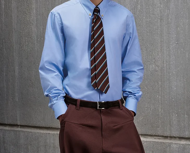 KNT Autumn Winter 2026/2027 menswear look featuring tailored outerwear and technical knitwear.