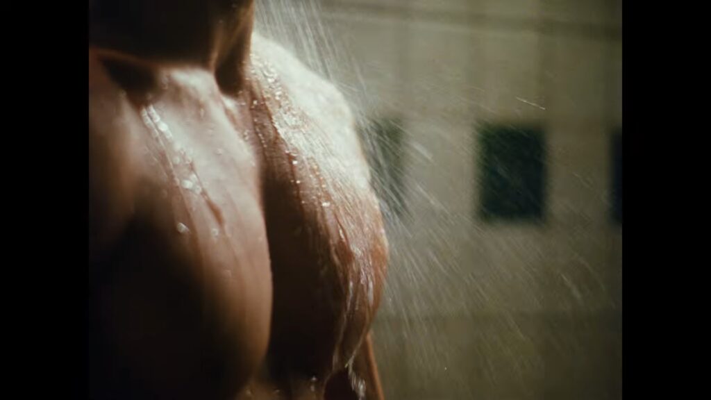 Taylor Zakhar Perez leaning back in the shower in a calm, relaxed moment for the Lacoste shoot