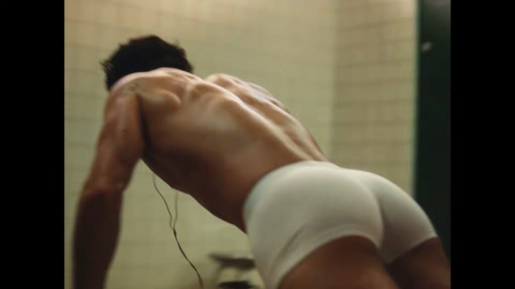 Taylor Zakhar Perez showing playful dance moves in a locker room for Lacoste