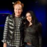 Charli XCX chatting with Conan O’Brien during podcast appearance