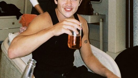 Noah Jupe posing during the “Hamnet” promo tour, showcasing his sharp and modern fashion style.