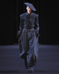 Model wearing JUUN.J FW26 runway look at Théâtre National de Chaillot