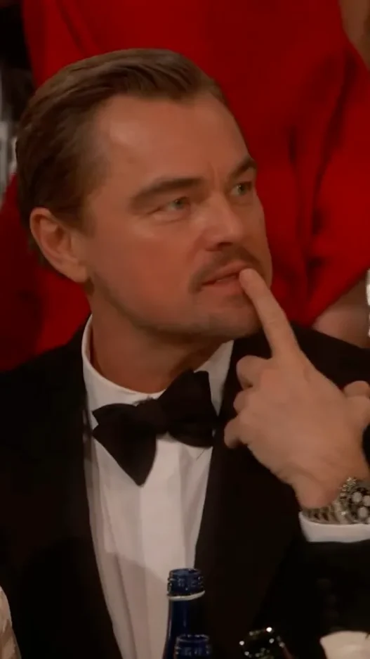 Leonardo DiCaprio reacting with animated expressions at the 2026 Golden Globes