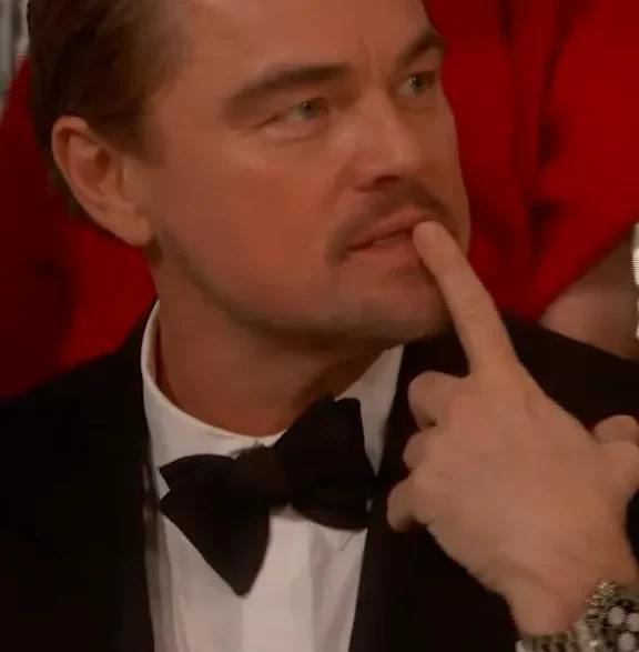 Leonardo DiCaprio reacting with animated expressions at the 2026 Golden Globes