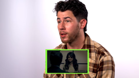 Nick Jonas reacting to his most iconic career moments in an online interview