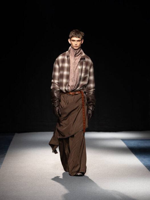 Songzio FW26 runway featuring sculptural looks from “Crushed, Cast, Constructed”