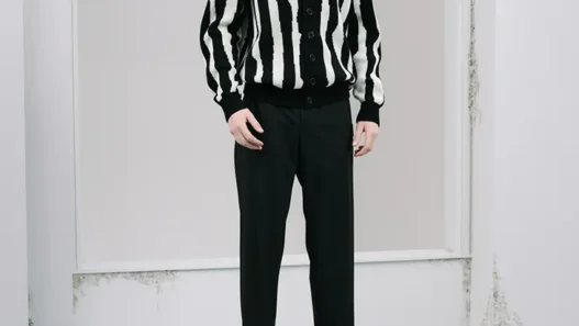 UNDERCOVER Pre‑Fall 2026 menswear look featuring refined minimalist tailoring and contemporary wardrobe staples.