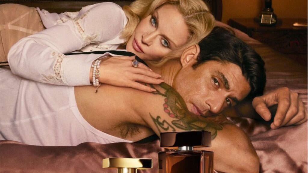 Madonna in Dolce & Gabbana’s “The One” director’s cut, styled in a rainy cinematic city scene