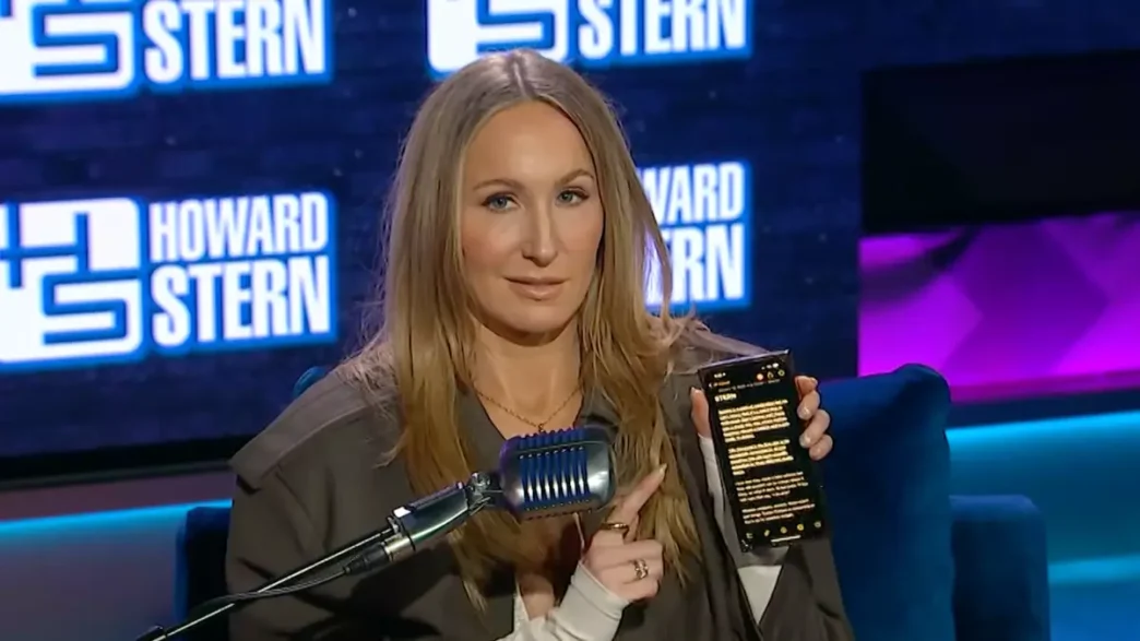 Nikki Glaser hosting the 2026 Golden Globes, delivering sharp comedic monologue on stage.