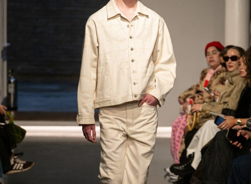 Look from Ksenia Schnaider’s Fall/Winter 2026 “Denim Workshop” runway collection featuring deconstructed and reconstructed denim elements