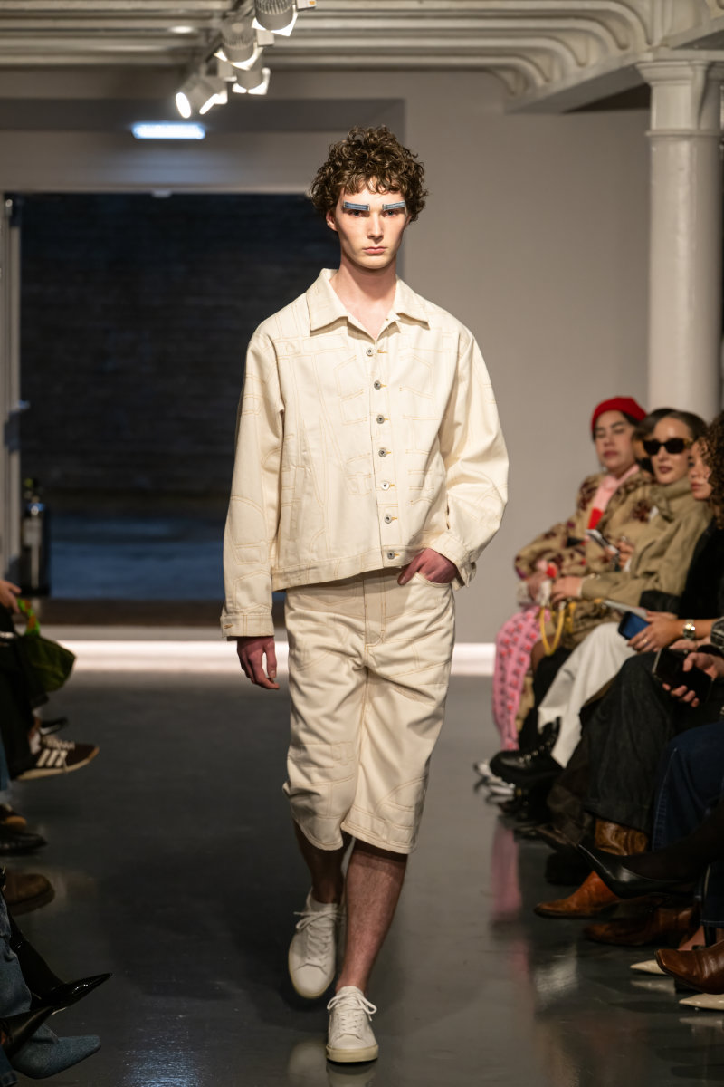 Look from Ksenia Schnaider’s Fall/Winter 2026 “Denim Workshop” runway collection featuring deconstructed and reconstructed denim elements