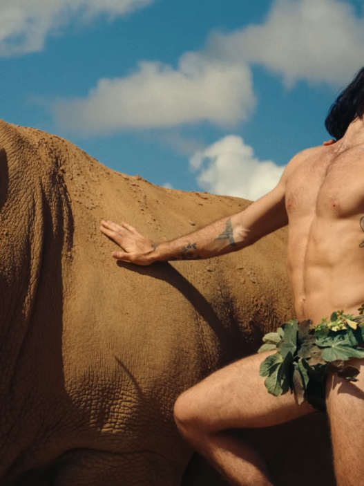KJ Apa as Mr. Fantasy in his rainforest‑themed “One Last Night” music video.