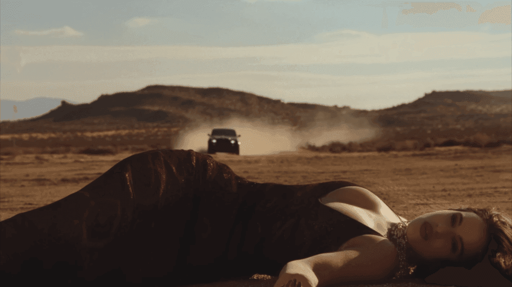 Rosalía performing in moody desert visual