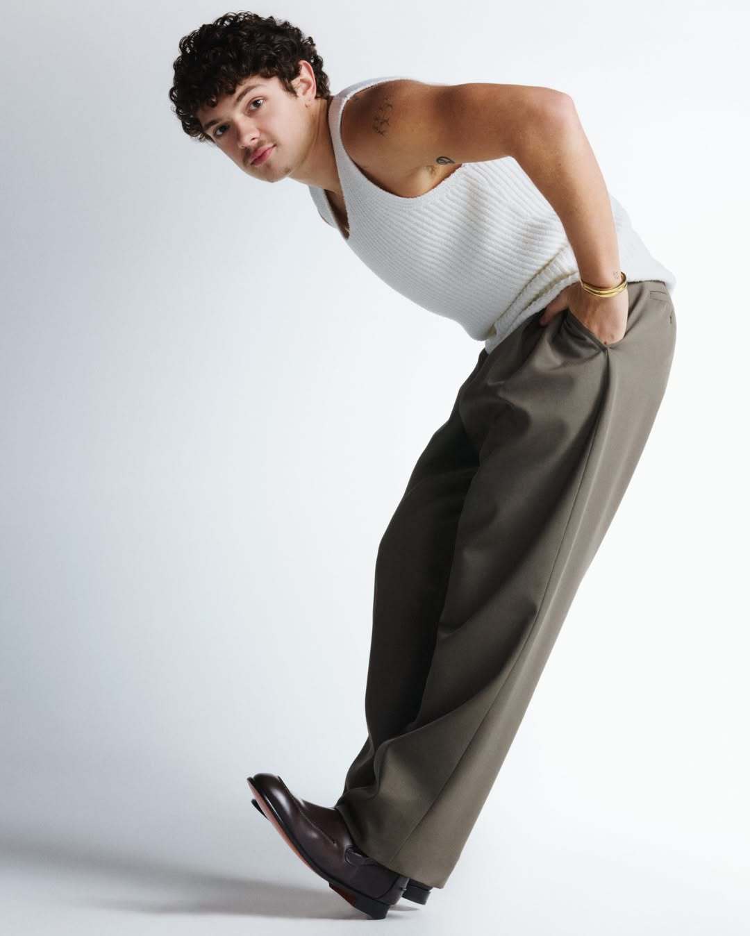 Full‑body shot of Noah Jupe at a promotional stop