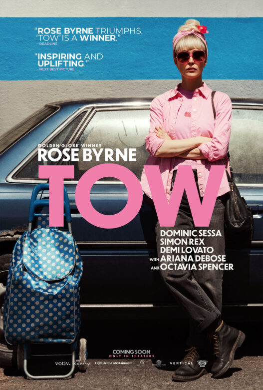 Rose Byrne standing beside her Toyota Camry in a official theatrical poster from TOW