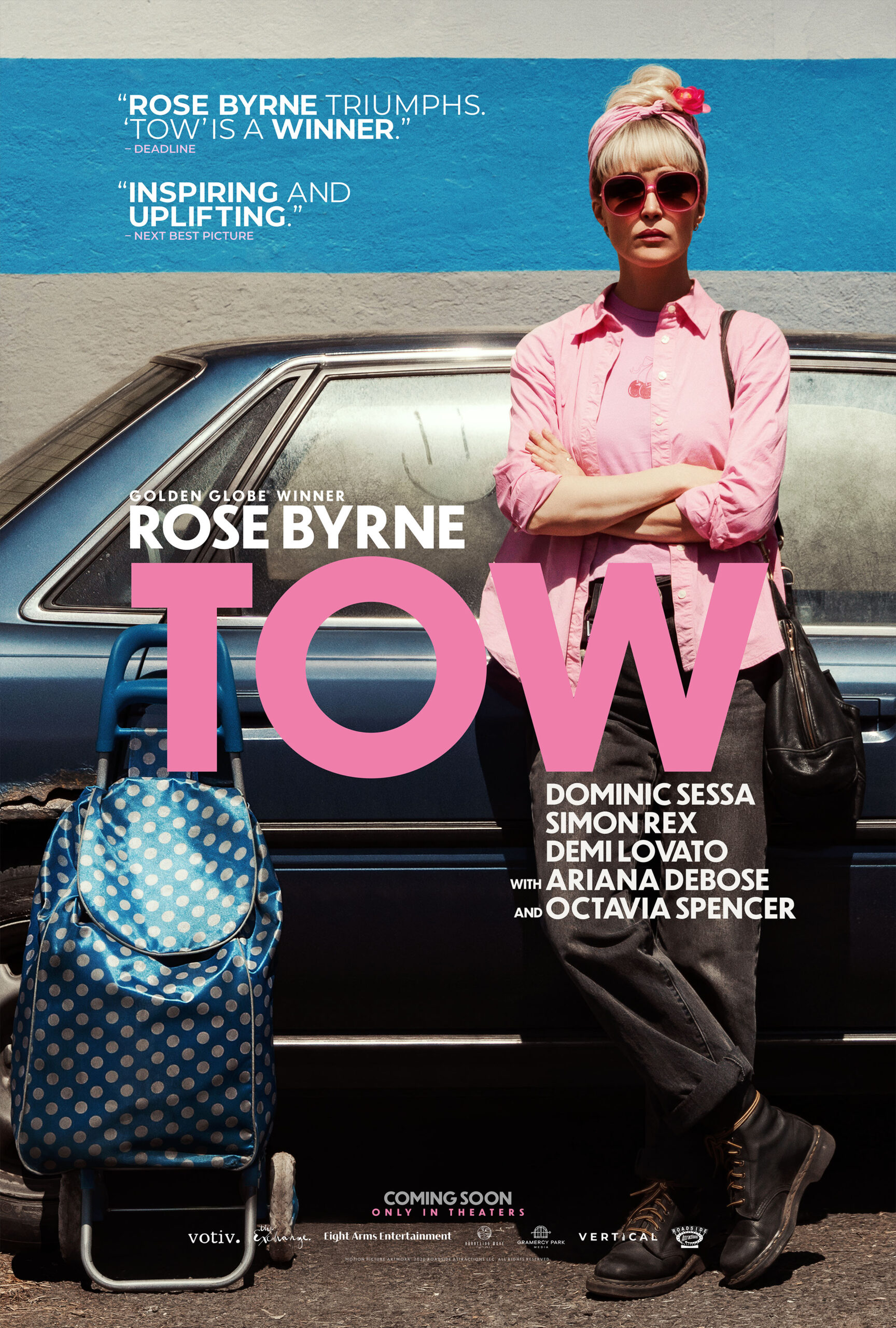Rose Byrne standing beside her Toyota Camry in a official theatrical poster from TOW