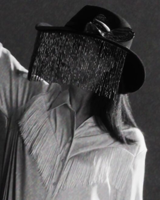 Jessie Ware in a still from the minimalist black‑and‑white visualizer for her single “Ride.”