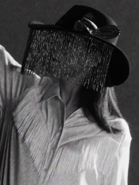 Jessie Ware in a still from the minimalist black‑and‑white visualizer for her single “Ride.”