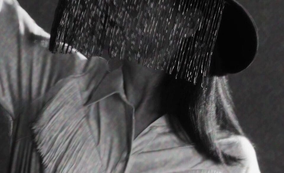Jessie Ware in a still from the minimalist black‑and‑white visualizer for her single “Ride.”