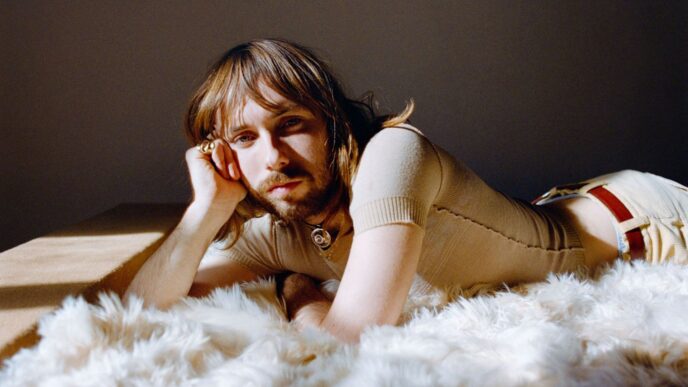 Lewis OfMan posing in a promotional still