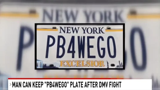 Long Island grandfather Seth Bykofsky holding or standing near his “PB4WEGO” license plate after winning his DMV dispute.