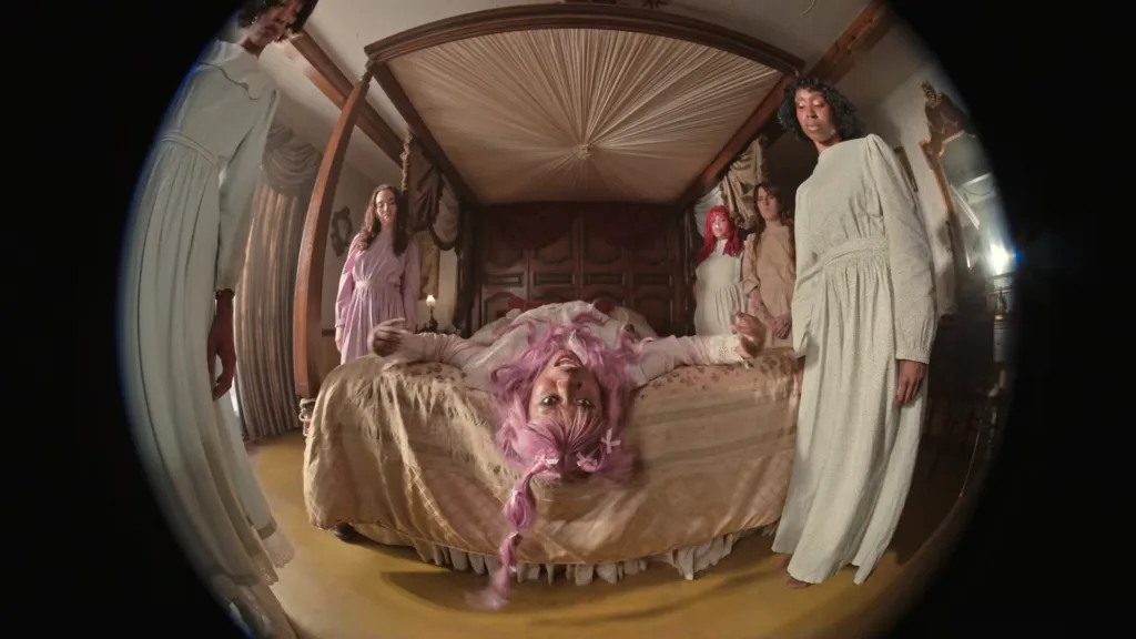 Still from Hemlocke Springs “be the girl!” music video from her debut album.
