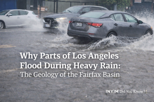 Cars drive through deep floodwater on Melrose Avenue in Los Angeles during heavy rain, highlighting stormwater pooling in the Fairfax Basin.