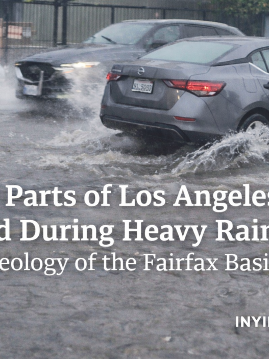 Cars drive through deep floodwater on Melrose Avenue in Los Angeles during heavy rain, highlighting stormwater pooling in the Fairfax Basin.