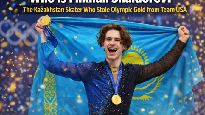 Mikhail Shaidorov of Kazakhstan celebrates after winning Olympic gold in men’s figure skating at the Milano Cortina Winter Games, holding his medal as confetti falls.