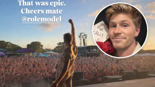 Robert Irwin onstage at Laneway Festival 2026 in Perth with his fist raised toward a packed sunset crowd, featuring a circular inset of his face holding red roses and a handwritten “For Sally” note.