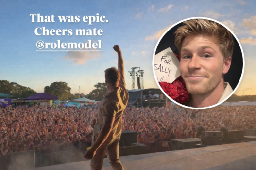 Robert Irwin onstage at Laneway Festival 2026 in Perth with his fist raised toward a packed sunset crowd, featuring a circular inset of his face holding red roses and a handwritten “For Sally” note.