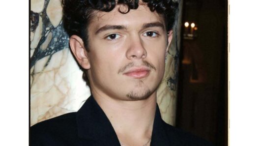 Noah Jupe posing on the red carpet during the Hamnet promo tour.