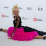 Betsey Johnson posing on the red carpet at Elton John’s Oscars viewing party