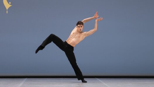 William GYVES performing his contemporary variation at the Prix de Lausanne 2026 Finals, captured mid‑movement by photographer Gregory Batardon.