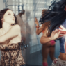 FLO fight scene in a sleek, high‑fashion scene from the “Leak It” music video.