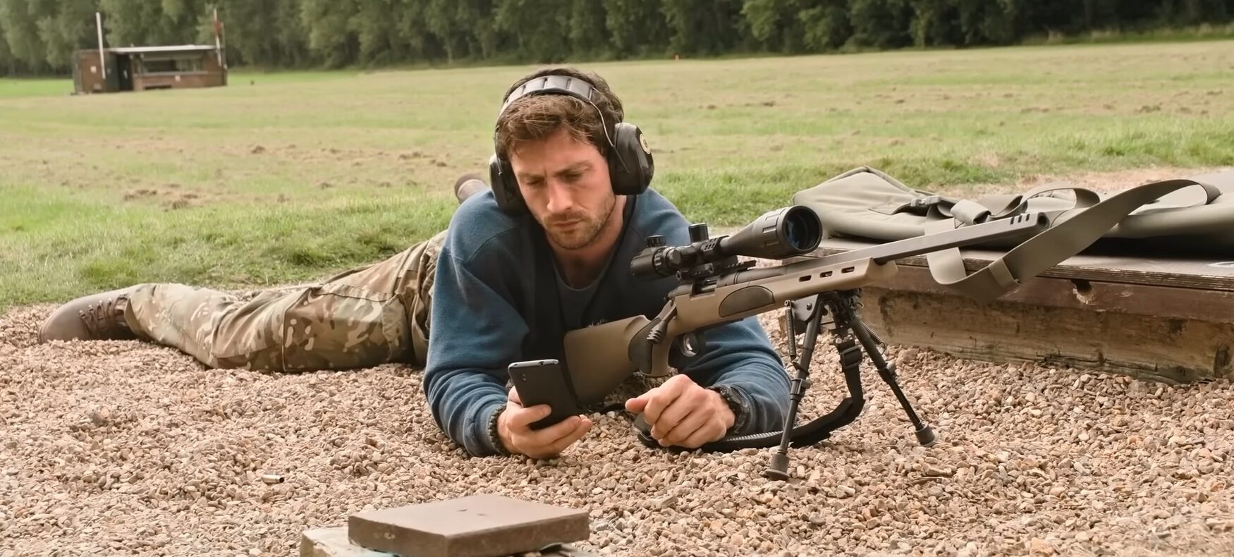Aaron Taylor-Johnson at a rifle range in the military heist thriller Fuze.