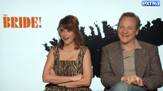 Penélope Cruz discussing her role as detective Myrna Mallow in “The Bride!” during an interview with Extra.