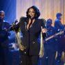 Jill Scott performing “Pressha” live on The Tonight Show Starring Jimmy Fallon, bathed in warm stage lighting